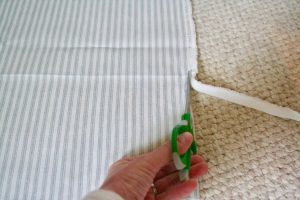 trimming the edges off of fabric for garland