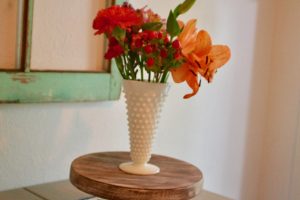white hobnail vase with flower boquet