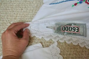 glue ends down on vintage pillowcasewith glue