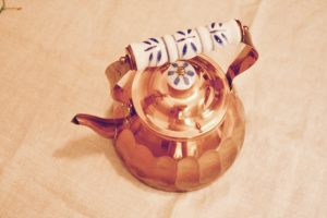 vintage copper teapot with porcelain handle