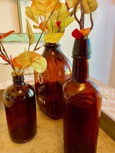 vintage amber colored bottles with faux fall stems