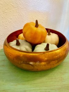 pumpkins in a copper bowl