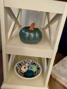 pumpkins displayed on a side table