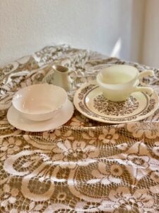 a grouping of vintage dishware