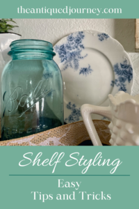a wall shelf decorated with vintage decor for early Spring