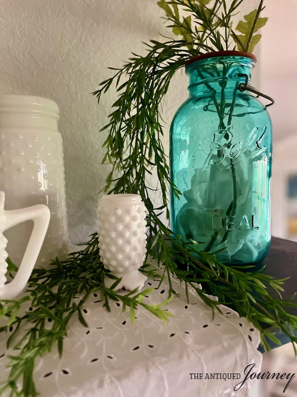 vintage hobnail milk glass glass styled on a shelf