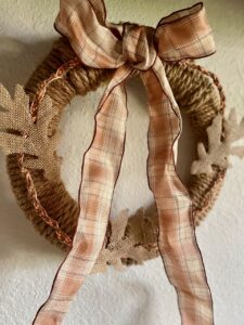 Simple braided rope wreath DIY for Fall with a plaid ribbon