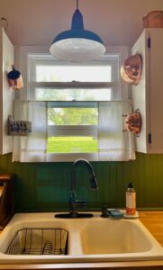 a vintage salt box styled in a kitchen