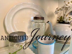 clear glass jars styled in a hutch for Summer