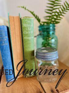 vintage jars styled in a vignette with books