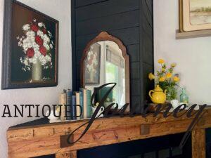 a mantel styled for Summer with vintage finds