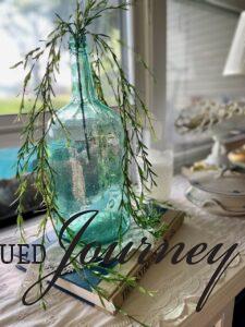 vintage blue jug with greenery for summer