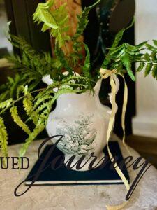 a vintage transfer ware pitcher filled with faux ferns for Summer