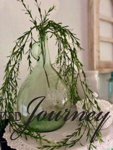 a thrifted green glass jug styled for Summer