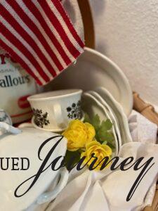 faux yellow flowers and vintage decor in a basket vignette