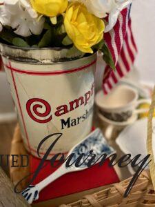 a vintage marshmallow tin used for a patriotic decor vignette