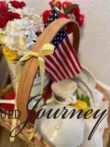 yellow gingham ribbon tied onto a vintage patriotic vignette