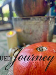 fall porch decor using pumpkins and candles