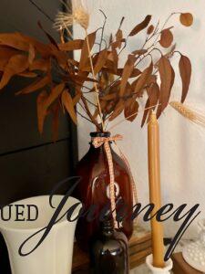 fall mantel decor with wood elements