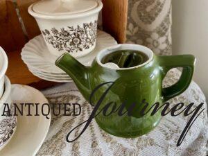 thrifted green hall teapot styled with some ironstone