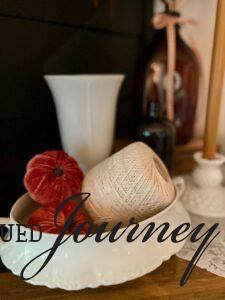 fake pumpkins inside a ironstone tureen for fall