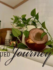 vintage copper pot above kitchen cabinets