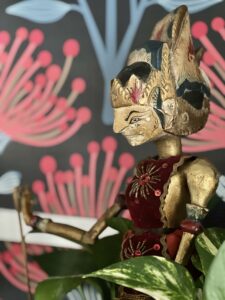 a thrifted Asian rod puppet from Sonata Home Design