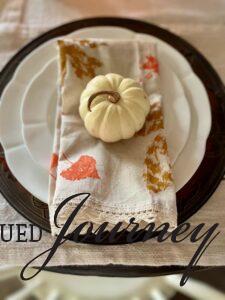 a finished leaf stamped napkin on a table setting