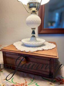 vintage wooden hanky drawer used for holding a milk glass lamp