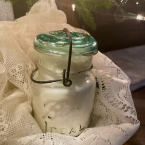 a sustainable and stylish hand poured soy wax Christmas candle in a vintage ball jar for a lovely holiday scent