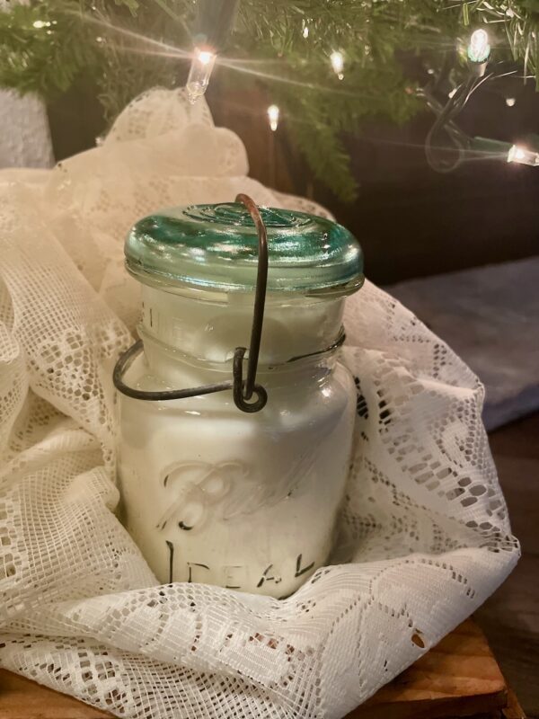 a sustainable and stylish hand poured soy wax Christmas candle in a vintage ball jar for a lovely holiday scent