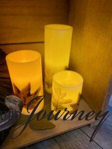 faux pillar candles styled in a budget friendly thanksgiving vignette