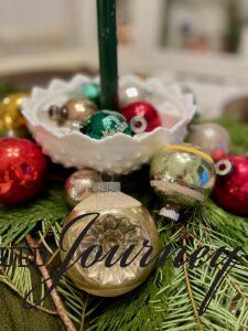 vintage Christmas ornaments bought secondhand used on a Christmas table setting