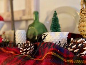 a thrifted red plaid scarf used as a shelf accent for Christmas decor