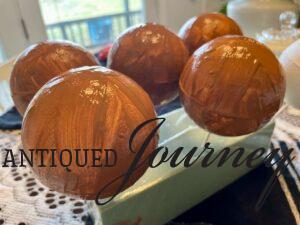 brown painted foam balls for making DIY Christmas ornaments