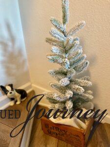 a small flocked tree for entryway decor