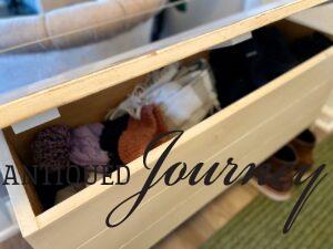 a multi-functional storage bench for winter wear in a small entry