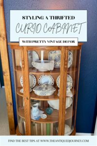 a thrifted antique curved cabinet styled in a bedroom