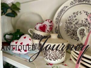 balancing symmetry in a hutch with rustic valentine decor