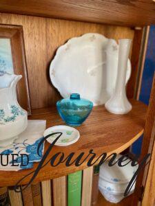 vintage decor styled in a wood curio cabinet vintage home finds