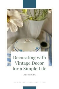 vintage decor finds styled in a vignette with flowers