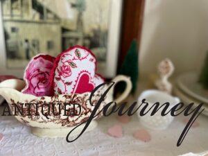 vintage gravy boat styled with fabric hearts for valentines day