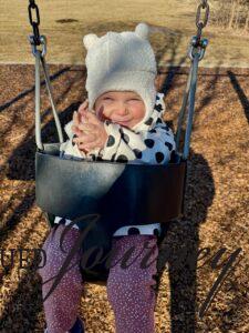 Molly swinging at the park
