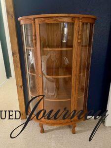 thrifted antique curved cabinet