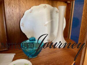 vintage decor styled in a thrifted curio cabinet 