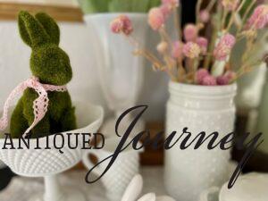 vintage milk glass used for Spring decor on a fireplace mantel