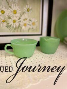 vintage table runner used for shelf decor in a hutch