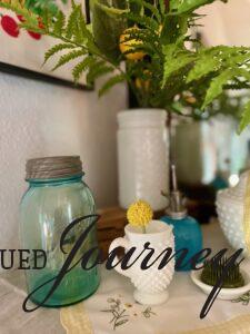 vintage decor styled on a mantel for summer
