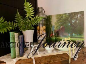 vintage books on a mantel vignette