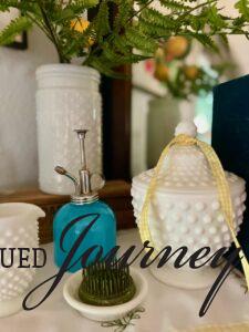 vintage decor styled on a mantel for summer decorating